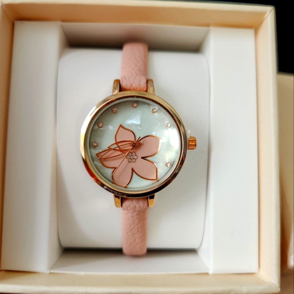 NWB Pink Band and Rose Gold Color Fashion Watch never been out of box.